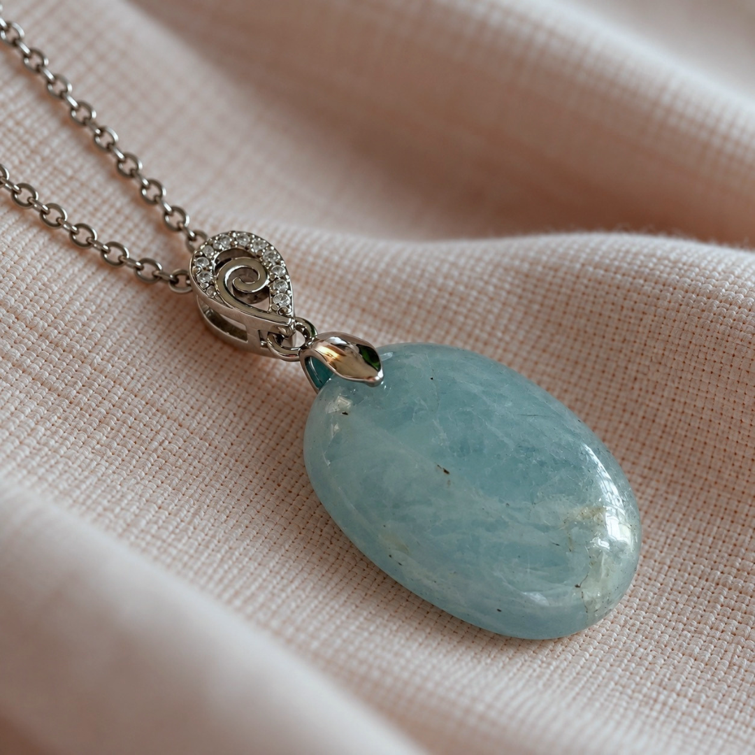 Close-up of natural Aquamarine pendant showing blue colour and natural inclusions