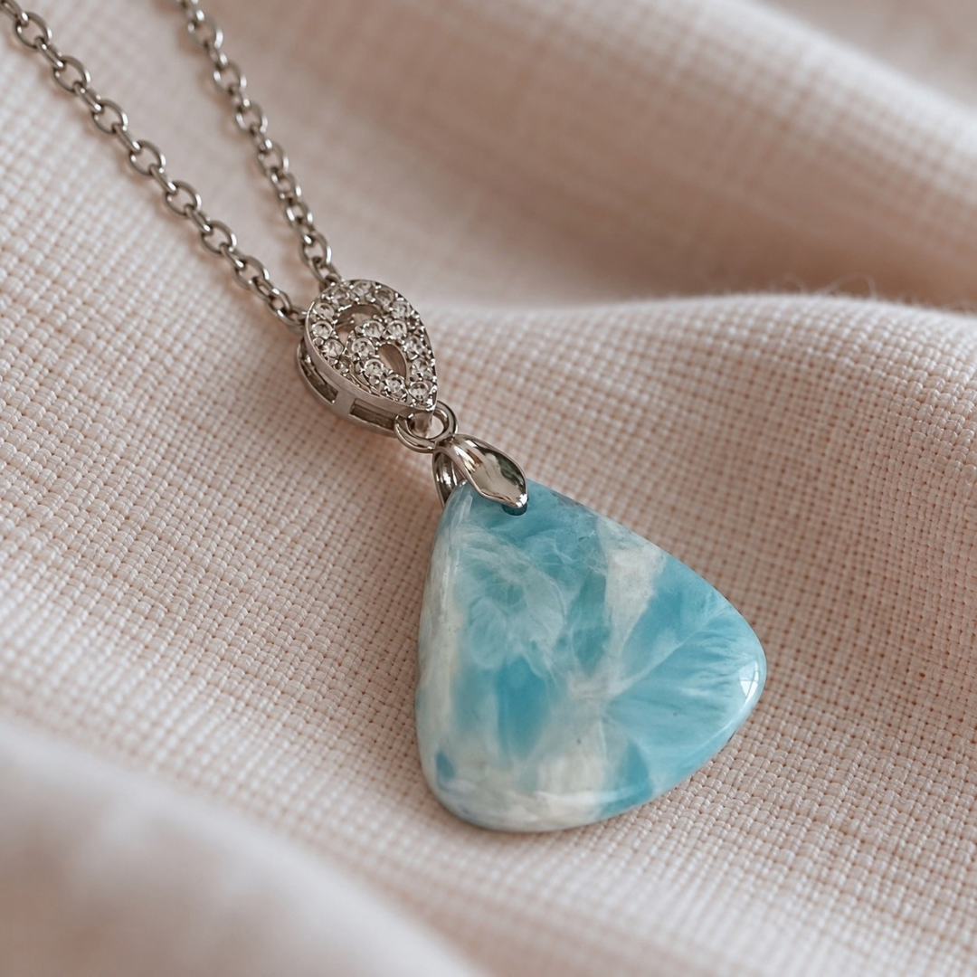 Close-up of natural Larimar pendant showing blue and white patterning